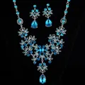 Parure de bijoux élégante avec zircons bleus en goutte et design fleurs ajouré argenté - Ensemble 2 pièces or et bleu