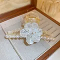 Detailed macro shot of an elegant white pearlescent flower and pearl hair claw clip - 3D Floral Pearl Style (2#)