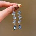 Élégantes boucles d'oreilles papillon bleu clair avec pompons et pampilles en cristal - Style Pendentif Gland Papillon (38#)