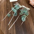 Longues boucles d'oreilles à pampilles en disque vert translucide avec nœud blanc et perles - Style Gland à Noeud (40#)