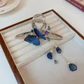 Elegant silver metal claw clip featuring blue embroidered butterfly and long beaded tassels - Embroidered Butterfly Tassel Style (12#)