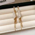 Elegante goldfarbene Quasten-Ohrhänger mit funkelnden Zirkonia-Kristallclustern - Quasten-Ohrsteckerstil (95#)