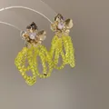 Elegante goldene Zirkon-Blumenohrringe mit leuchtend gelben Kristallperlenquasten - Aufwendige Quasten Strass Blume (22#)