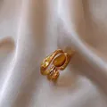 Macro detail of high-quality vintage gold-plated ring with zircon and tiger eye stones - Double Layer Open Style (HR2343) / Gold with Coffee