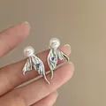 Elegant silver mermaid tail earrings with pearl and blue heart stone detail - Style 44 / Silver