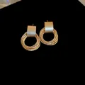 Elegant matte gold multi-layer textured hoop earrings with a minimalist circular design - Style 71 / Gold
