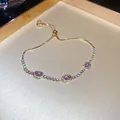 Elegante pulsera dorada ajustable con tres dijes ovalados de resina rosa y pavé de piedras - Estilo 35# Dorado Rosa Tres Piedras