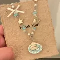 Boho-Halskette im Urlaubsstil mit Perlen und einem Muschel-Anhänger mit Sternen - Stil 6 Blau Weiß Gestreifte Schnecke Schleife