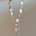 Böhmische Seestern-Halskette mit schimmernden Muschelperlen und Goldanhänger-Finish. - Stil 8 Gold Realistischer Seestern Muschelperlen
