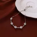 Elegante bracciale d'argento regolabile con ciondoli in cristallo su seta rossa - Stile Dispositivo di Scorrimento Regolabile Ovale Bianco Tonalità Argento