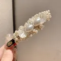 Elegant white pearl petal hair clip with vintage handmade gold tag for women - Duckbill Hair Clips / Single Piece / White