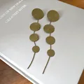 Detailed view of vintage gold layered circle tassel earrings with textured finish - Spiral Disc Tassel Style (HE27454) / Green
