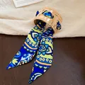 Detailed view of a gold-tone wide metal cuff bracelet featuring a blue patterned silk scarf - 8# Gold Blue Floral Pattern