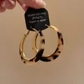 Detailed view of vintage tortoiseshell leopard print hoop earrings with gold trim - Style 25 Vintage Tortoise Hoop Earrings with Silver Post / Gold Brown