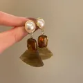 Elegant vintage gold-tone earrings featuring white pearl studs and amber resin drop pendants - Style 45 Pearl Resin Pendant Earrings with Silver Post / Brown