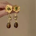 Close-up of vintage floral tassel earrings with green rhinestones and brown teardrop pendants - Leopard Heart Tassel Style (5#) / Gold
