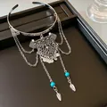 Detailed view of retro silver armlet with tribal pendant, turquoise beads and leaf charms - Rhombus Tassel Style / Silver