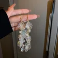 Elegant long iridescent petal tassel earrings with white pearls and silver needles - Gold Pearl Shell Tassel