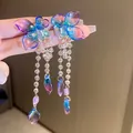 Elegant long tassel butterfly earrings featuring blue and purple gradient resin flower petals - Blue Butterfly Flower Petal Tassel