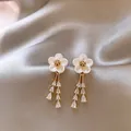 Elegant shell flower drop earrings with dangling pear-cut clear zirconia crystals - Gold