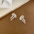 Elegant minimalist silver bow ribbon stud earrings with delicate scalloped edge design - Silver #10