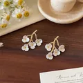 Elegant silver needle earrings featuring white shell flower petals on golden branch design - 11# Gold-White