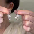 Elegant silver hoop earrings featuring a sparkling leaf-shaped crystal flower cluster design - 14# Silver