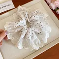 Elegant white lace scrunchie with black polka dots, perfect for stylish daily hair styling. - Polka Dot Lace Style (HH6870) / White