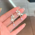 Elegant shell flower drop earrings with sparkling rhinestones and a gold-tone finish - Gold-White