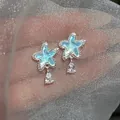Elegant silver star shell stud earrings with sparkling teardrop crystal pendants - Silver-Blue
