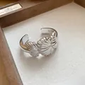 Close-up of silver-tone shell textured open cuff bracelet with heavy-duty design - Seashell Pleated Style (HB4190)