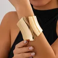 Detailed view of a wide asymmetric gold metal cuff bracelet with high-gloss finish - 1# Polished Large Style (HB3406)
