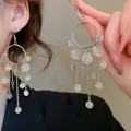 Elegant silver needle earrings with textured circular hoops and cascading metal tassels - Style 9 Silver Hook