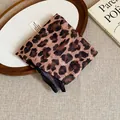 Detail view of a retro leopard print fabric headscarf on a stylish wooden tray. - Dark Leopard Print Style (16#)