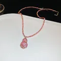 Elegant pink gourd pendant necklace featuring sparkling crystals and beaded chain design - Pink Bead Chain Style