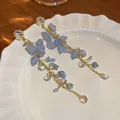 Elegant long tassel earrings featuring irregular blue stones and gold chain accents - Style 17