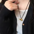 Elegant gold gourd pendant necklace with black cord in a new Chinese style - Black Cord Gold Gourd Style