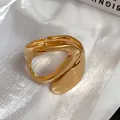Detailed view of the irregular geometric cutout and golden finish of the open bangle - Irregular Hollow Style 2 / Gold