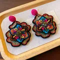 Close-up of vintage embroidered floral earrings with colorful beads and rhinestones - Flower Embroidery (HE23169) / Black Multicolor