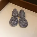 Close-up of elegant teardrop drop earrings encrusted with sparkling cubic zirconia stones - Antique Silver (2#)