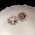 Close-up of sparkling amber sunburst earrings with brilliant light flare effect - Gold Coffee Real Gold Plating (15#)