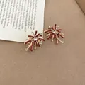 Detail view of red enamel firework-shaped earrings with clear zircon accents - Gold Red (18#)