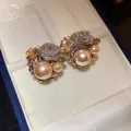 Close-up of elegant champagne pearl and mesh rose flower stud earrings in box - Coffee (31#)