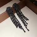 Elegant black shimmering zircon cascading tassel earrings displayed on a jewelry box. - Gunmetal Black (35#)