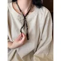 Handmade ethnic fabric necklace with wooden beads and vintage patterns in brown finish - Brown (Ripple Print)