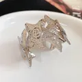Detailed view of a silver starfish-shaped metal cuff bracelet with wrinkled texture - Wrinkled Star Style (HB5173-1) / Silver