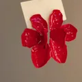 Elegant red painted flower stud earrings with subtle gold foil accents for women - Red