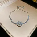 Elegantes Perlenarmband mit Zirkonia-Halo und verstellbarem Kordelzug in Geschenkbox - Einzelner Perlen-Zirkonia-Stil (46#) / Silber