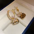 Elegant gold-tone earrings with large square amber zircon stones and snowflake detailing. - Gold Coffee Real Gold Plating (61#)