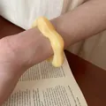 Light yellow wavy acrylic bangle bracelet in a minimalist sweet style for women - Wave Shape (HB3743-1) / Yellow